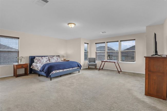 Bedroom featuring baseboards and carpet | Image 24