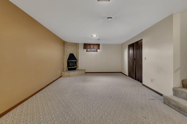 Huge Finished Lower Level Family Room with wet bar area and electric fireplace | Image 21