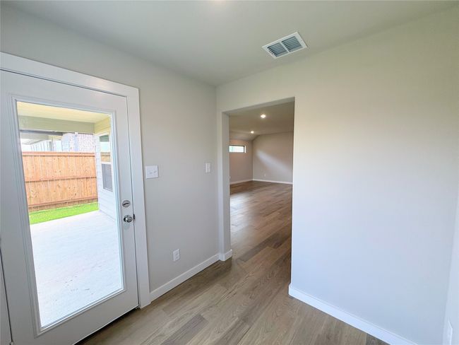 Doorway with light wood-style floors, baseboards, and recessed lighting | Image 28