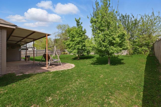 View of yard featuring a patio area and a fenced backyard | Image 35