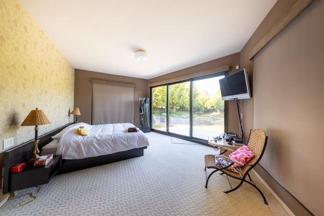 Carpeted bedroom with access to exterior, wallpapered walls, and baseboards | Image 27