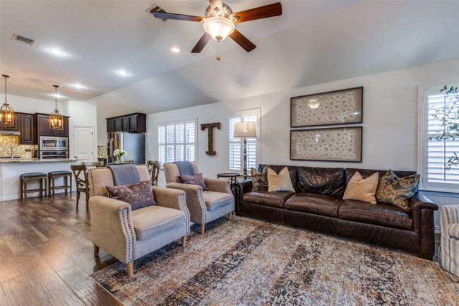 View of family room looking back into the kitchen. | Image 9