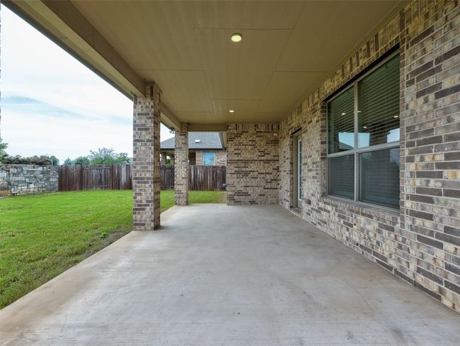 Lots of room to hang out on this covered patio with friends | Image 37