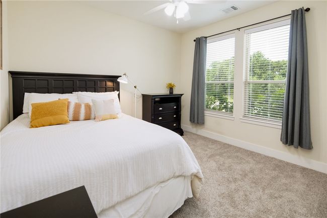 Carpeted bedroom featuring baseboards and a ceiling fan | Image 14