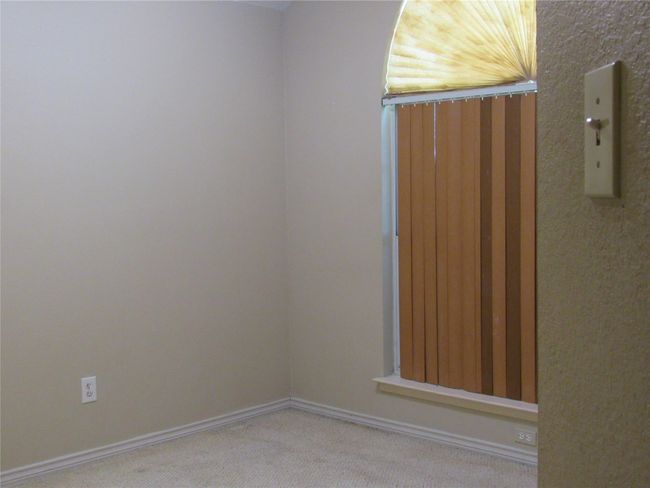Carpeted empty room with baseboards | Image 14