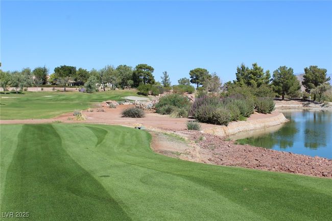 View of home's community featuring a lawn, a water view, and golf course view | Image 21