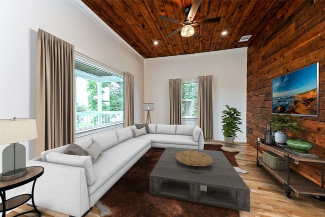 Living area with healthy amount of natural light, wood ceiling, wood finished floors, wooden walls, and crown molding | Image 7