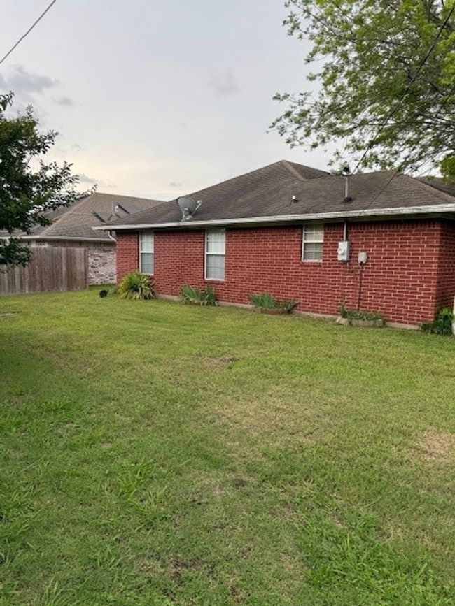 Rear view of house featuring brick siding | Image 7