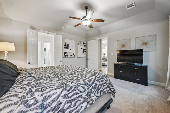 Carpeted bedroom featuring baseboards and a ceiling fan | Image 23