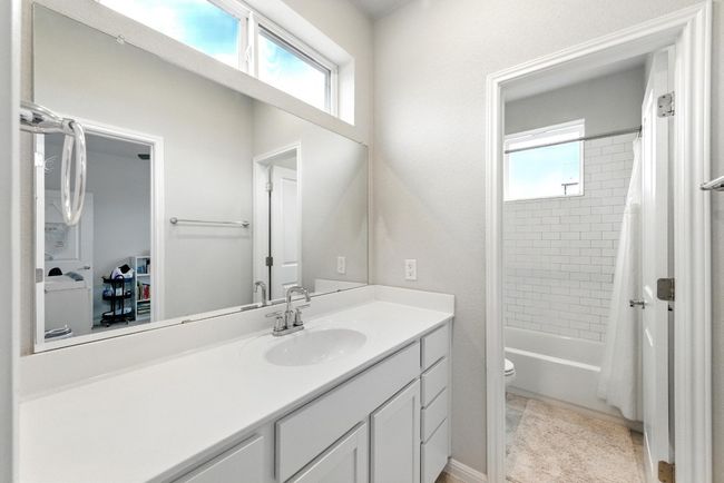 Jack and jill bathroom connects the two guest bedrooms. | Image 18