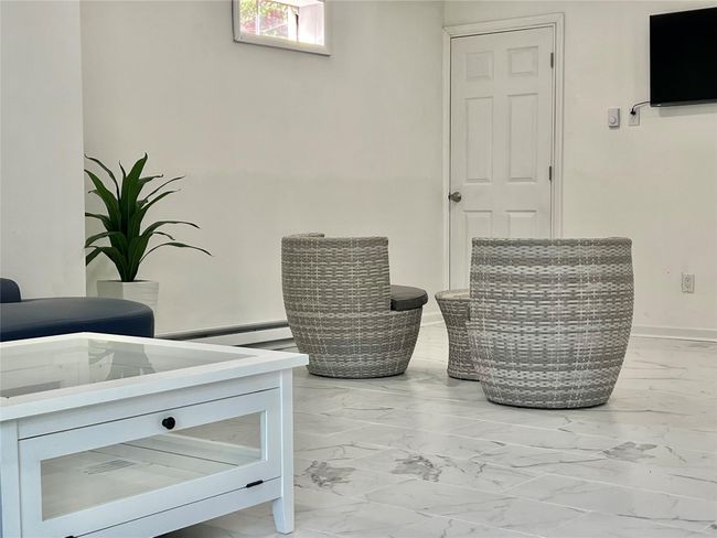 Interior details with a baseboard radiator and baseboards | Image 42