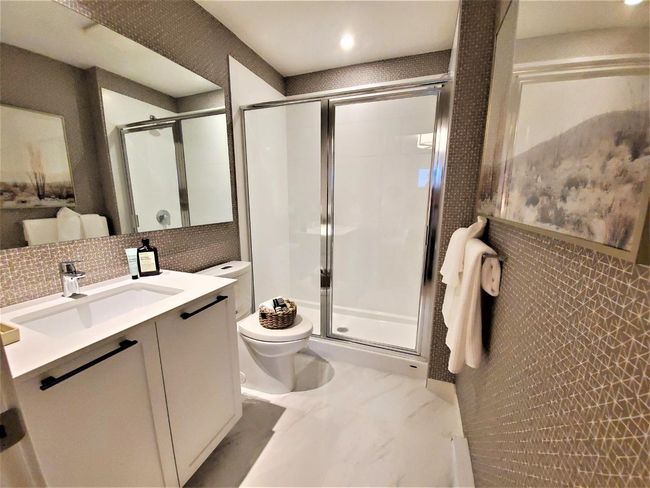 Bathroom with vanity, a stall shower, marble finish flooring, tasteful backsplash, and recessed lighting | Image 5