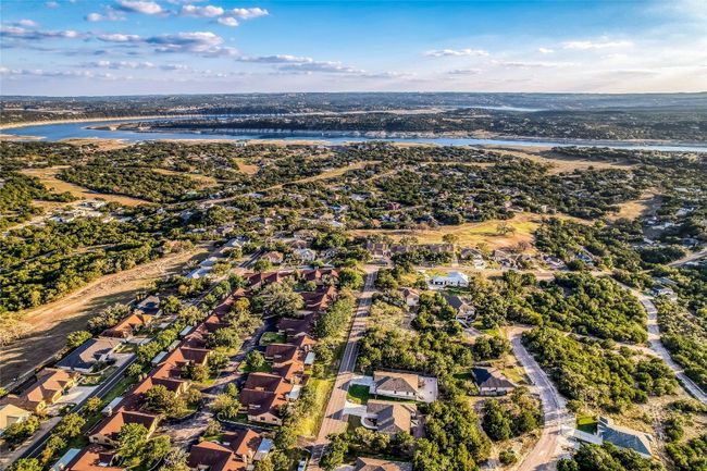 Aerial view of property's location with a large body of water and nearby suburban area | Image 36
