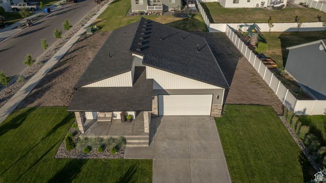 Get a stunning look at this modern home from above—partially fenced and perfectly situated in a newer neighborhood surrounded by natural beauty. Just minutes from outdoor adventures, parks, and trails! | Image 45