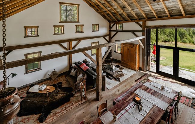 1920's sourced chestnut frame graces the main floor, loft ceiling rafters and the wide plank floors lending unique warmth and beauty throughout | Image 23