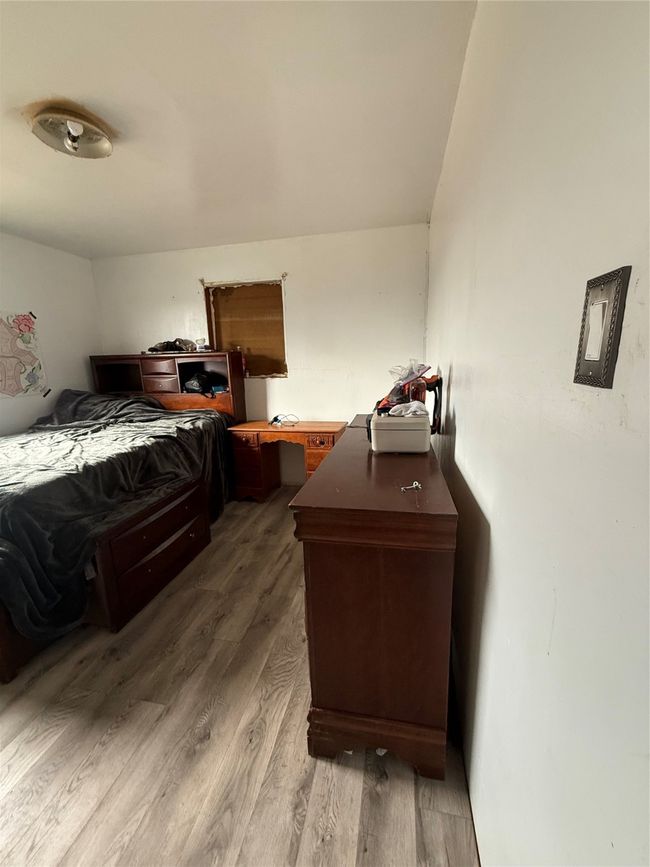 Bedroom featuring wood finished floors | Image 13