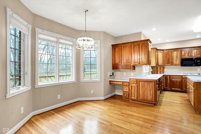 Casual dining space in Kitchen with bay windows looking to back yard | Image 15