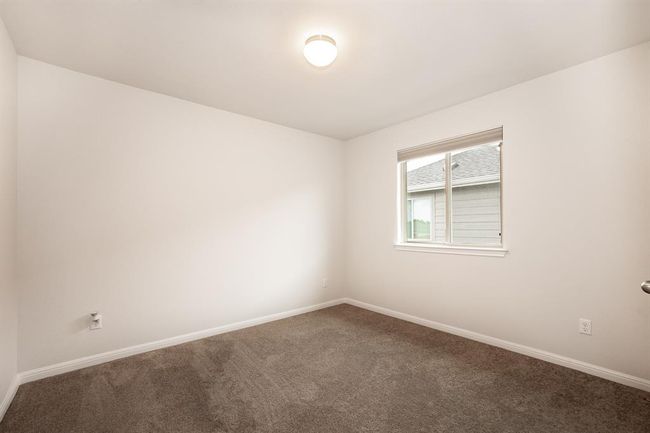 Spare room with carpet floors and baseboards | Image 26