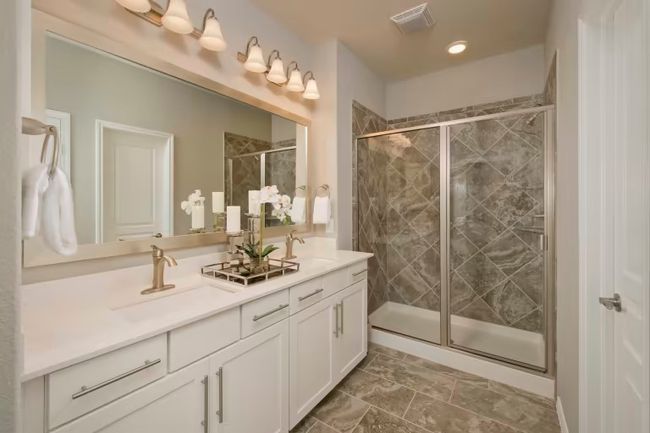 Photo of Pulte model home with same floor plan, not of actual home listed. | Image 9