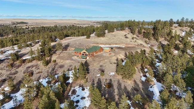 Birds eye view of property featuring a forest view | Image 19