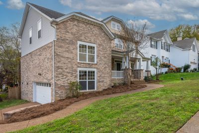 Side entry two car garage leaves the front exterior looking more luxurious. | Image 3