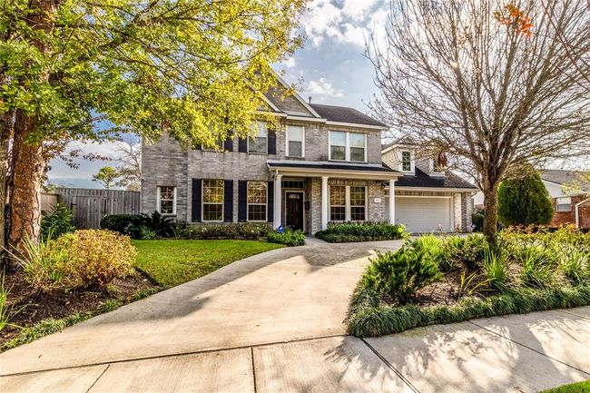 Turnaround driveway and attached garage. | Image 42
