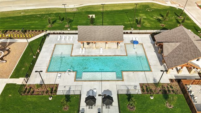 Aerial view of property and surrounding area featuring a pool area | Image 25