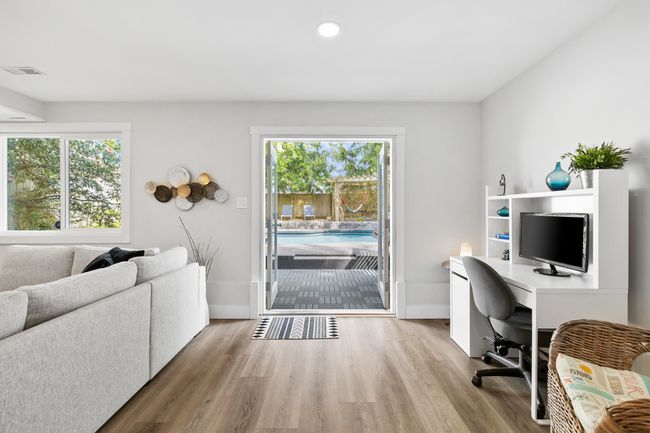 Office area with visible vents, baseboards, and wood finished floors | Image 21