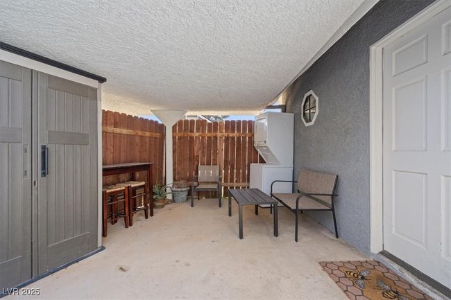View of patio / terrace featuring fence and stacked washer and dryer | Image 42