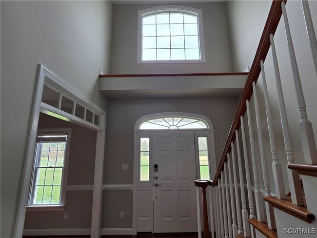 Back of property with a shingled roof and fence | Image 7