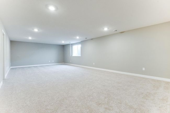 Another view point of FINISHED lower-level rec room included in list price! Photo of model home, color and options will vary. | Image 37