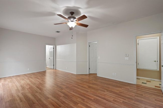 Primary bedroom with ceiling fan and walk-in closet | Image 22