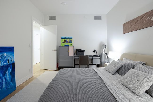 Bedroom featuring visible vents, light wood-style flooring, and baseboards | Image 15