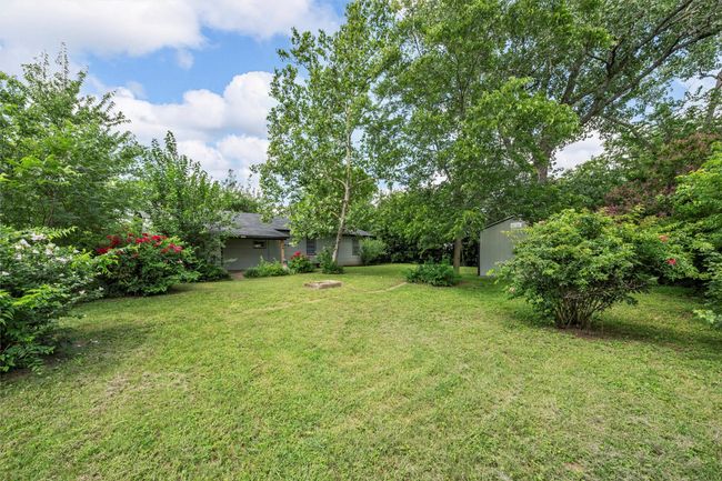 View of green lawn with a storage unit | Image 21