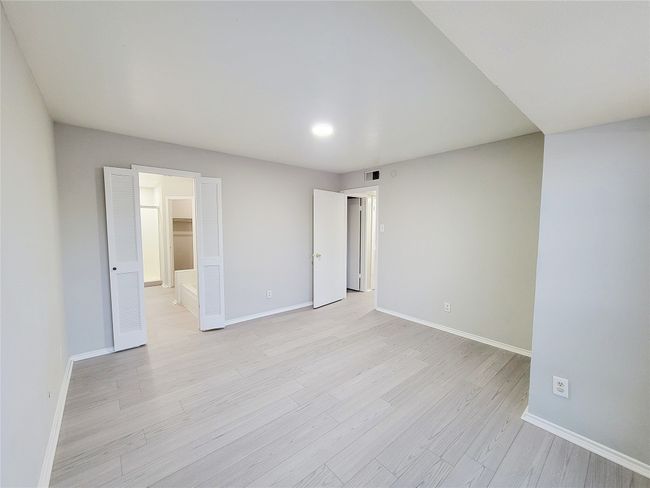 Unfurnished room with light hardwood / wood-style flooring | Image 11