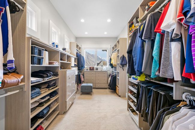 Spacious closet with light colored carpet | Image 41