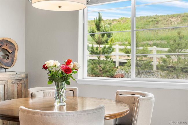 Dining room with upgraded chandelier and direct access to backyard | Image 17