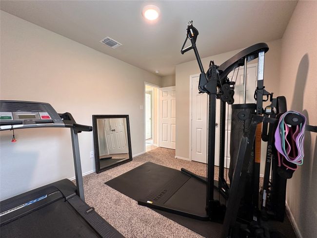 Exercise room with carpet and baseboards | Image 10
