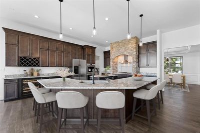 Stunning chef's kitchen with a huge breakfast bar island and granite counters! | Image 2