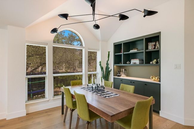 Dining room with lofted ceiling, light wood-type flooring, and baseboards | Image 6