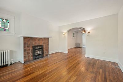 Living Room Featuring a Vintage Gas Fireplace | Image 3