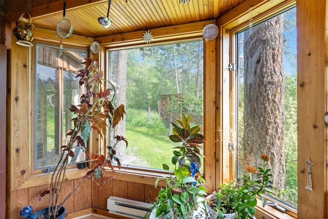 Sunroom / solarium featuring a baseboard radiator and plenty of natural light | Image 19