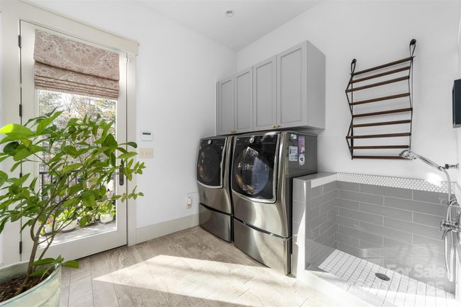 Main level laundry/mud room has walk-out to the patio and includes this fabulous dog/pet shower. | Image 15