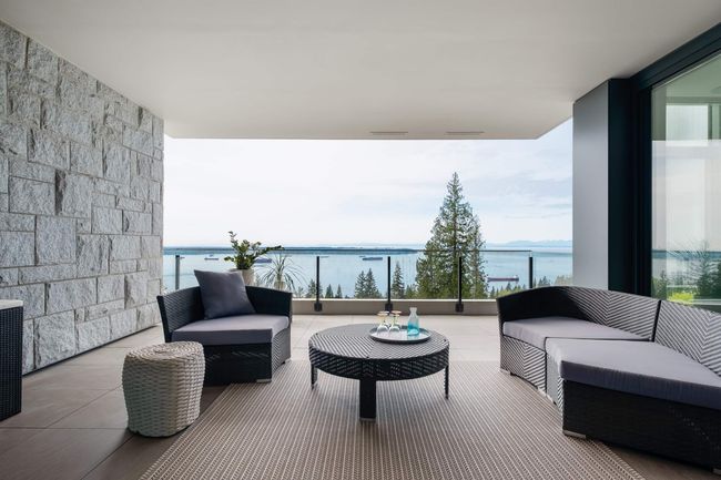 Balcony with a water view and an outdoor living space | Image 29