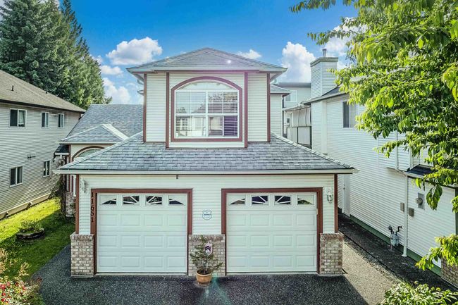 View of front of home with roof with shingles and driveway | Image 28