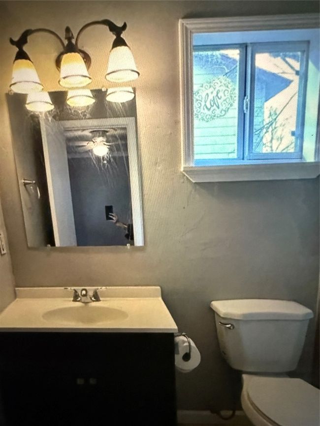 Bathroom featuring vanity and toilet | Image 15