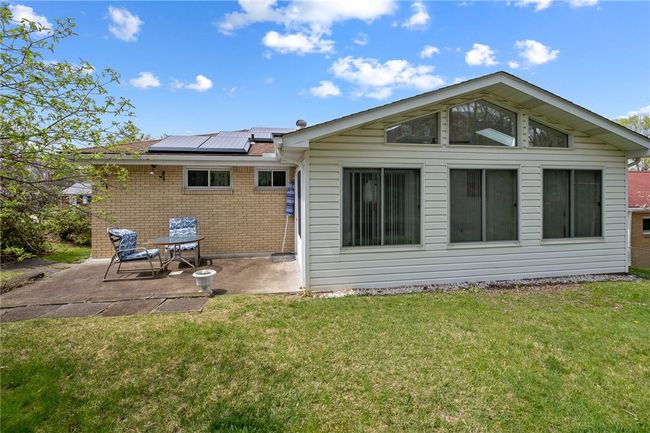 Space To Enjoy The Outdoors On The Patio Adjacent To The Sunroom | Image 20