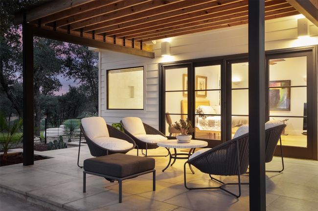 Main Bedroom covered patio with views of the Texas Hill Country and wired for sound. | Image 6