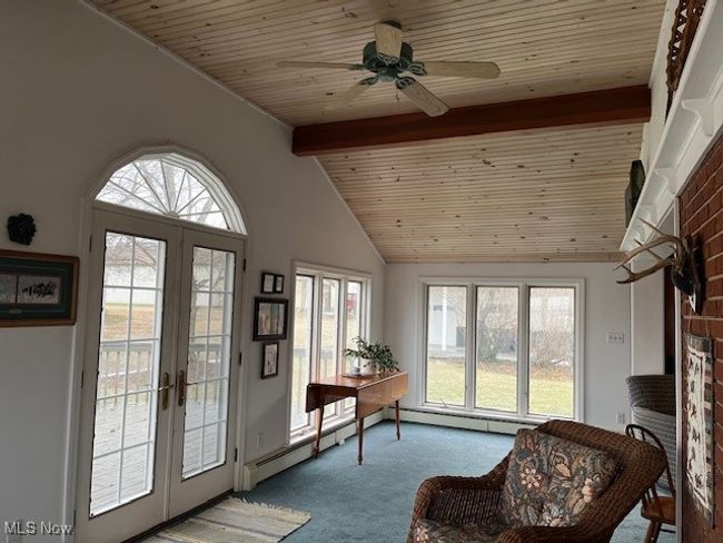 Newer addition with high ceiling & ceiling fan/ french doors opening to deck | Image 11