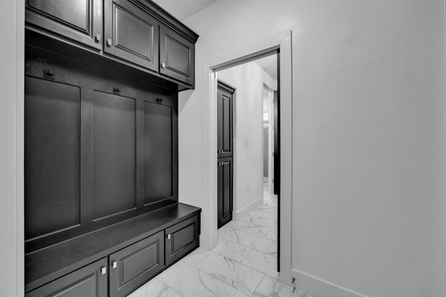 Mudroom featuring marble finish floor and baseboards | Image 16